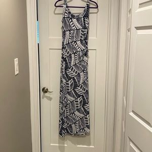 Dress is ankle length, white and navy blue.  A slit up the side.